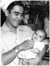 Henry Ford (Enrique Villalpando) holding his son Mike Ford, taken at Ford's restaurant, Canyonville, Oregon in 1945
